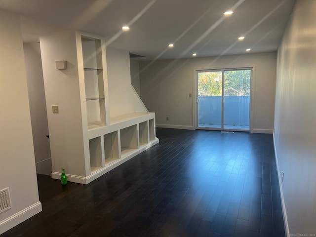 interior space with dark hardwood / wood-style flooring