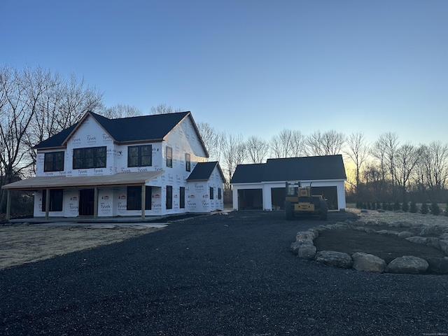 view of front of house with an outbuilding