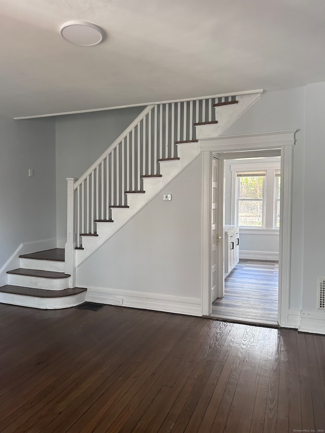 staircase featuring wood-type flooring