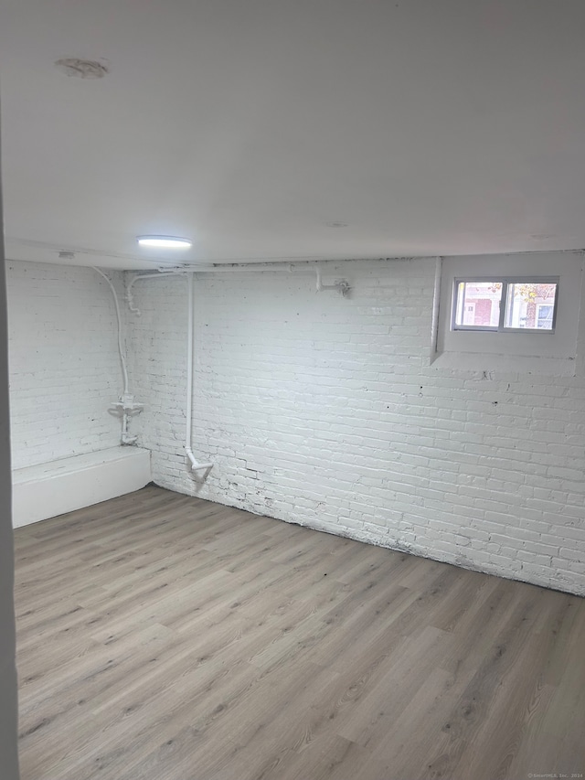 basement featuring light hardwood / wood-style floors