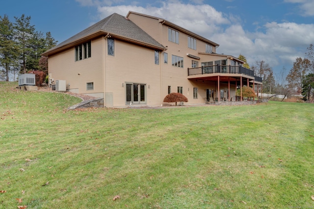 back of house with a lawn, a shed, and cooling unit