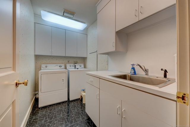 laundry room with cabinets, sink, and independent washer and dryer