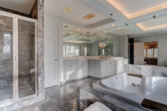 bathroom featuring vanity and separate shower and tub