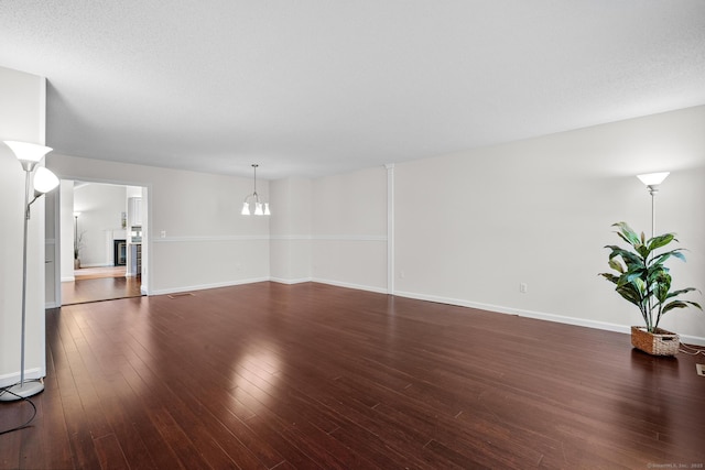 interior space with dark hardwood / wood-style flooring and a chandelier