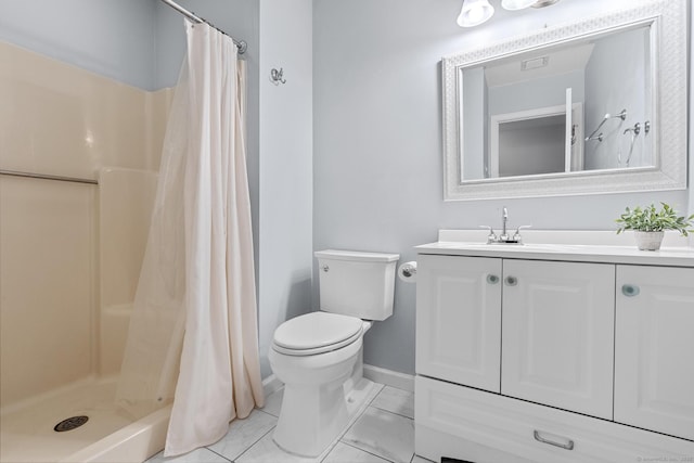 bathroom featuring toilet, a shower with shower curtain, and vanity