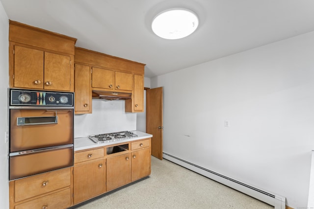 kitchen featuring stainless steel gas stovetop, oven, and baseboard heating