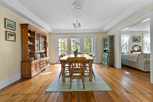 dining area featuring a chandelier and light wood-type flooring