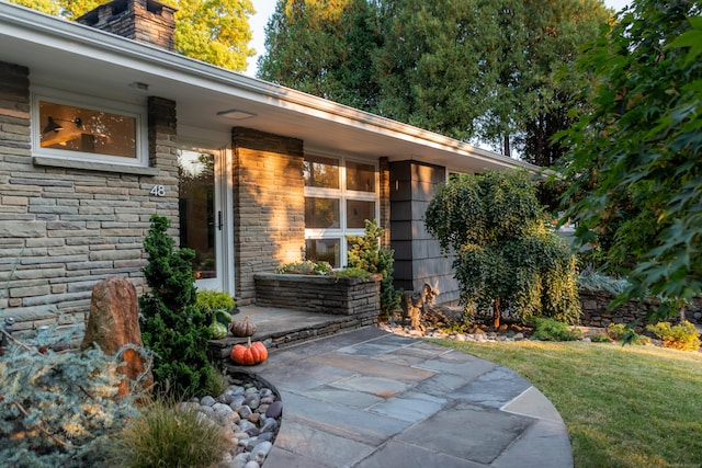 property entrance featuring a patio area