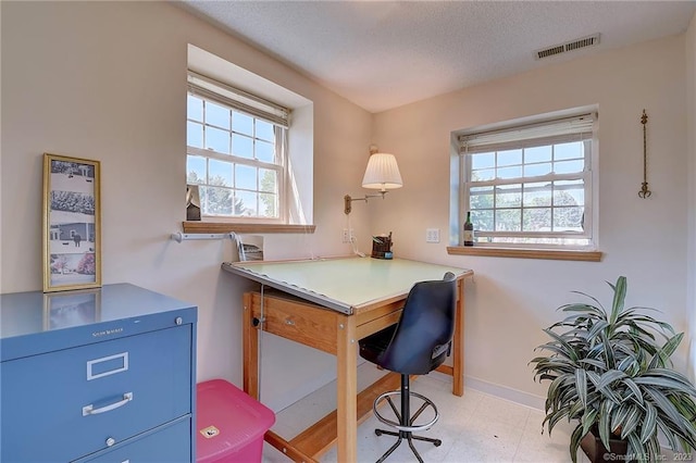 office area featuring a textured ceiling