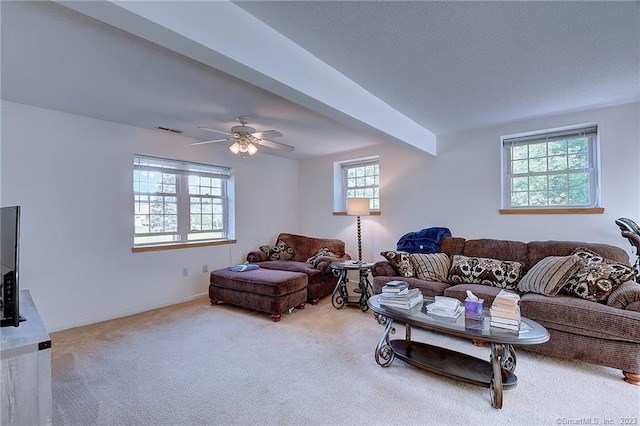 living room with a healthy amount of sunlight, carpet flooring, and ceiling fan