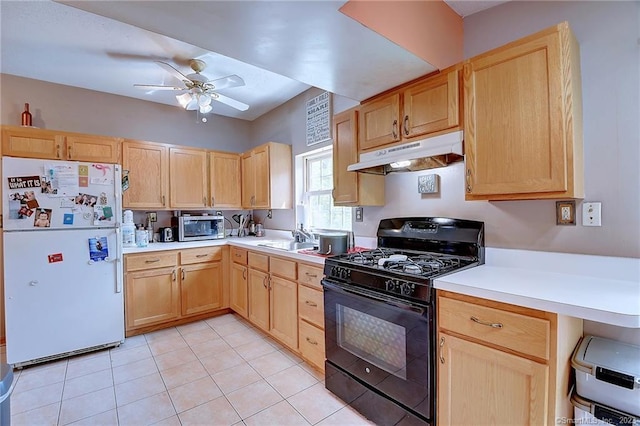 kitchen with black range with gas stovetop, light brown cabinets, white fridge, and light tile patterned flooring