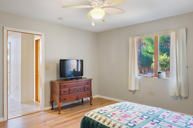 bedroom featuring ceiling fan and light wood-type flooring