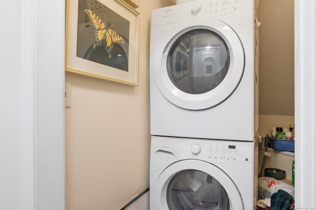 laundry room with stacked washer / dryer