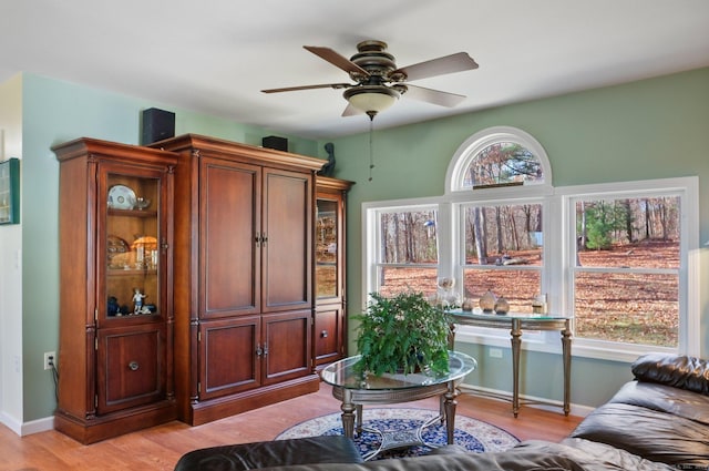 sitting room featuring ceiling fan and light hardwood / wood-style floors