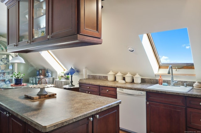 kitchen featuring a skylight, dishwasher, and sink