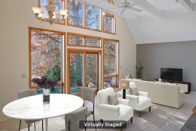 tiled living room featuring ceiling fan with notable chandelier and high vaulted ceiling