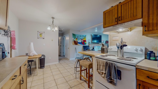 kitchen with light tile patterned floors, white range with electric cooktop, light countertops, under cabinet range hood, and a notable chandelier