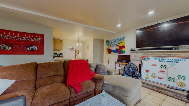 living area with recessed lighting and tile patterned floors