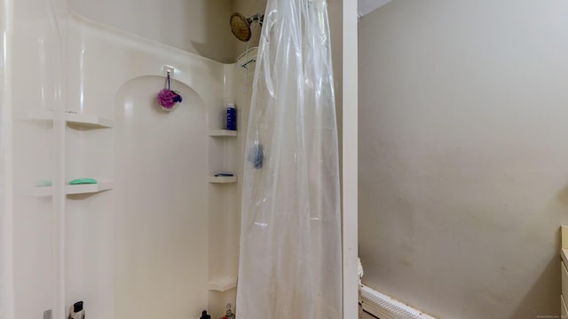 bathroom with curtained shower