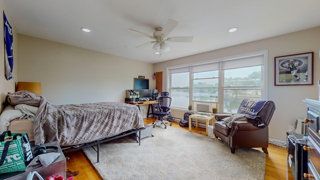 bedroom with ceiling fan, baseboards, wood finished floors, and recessed lighting