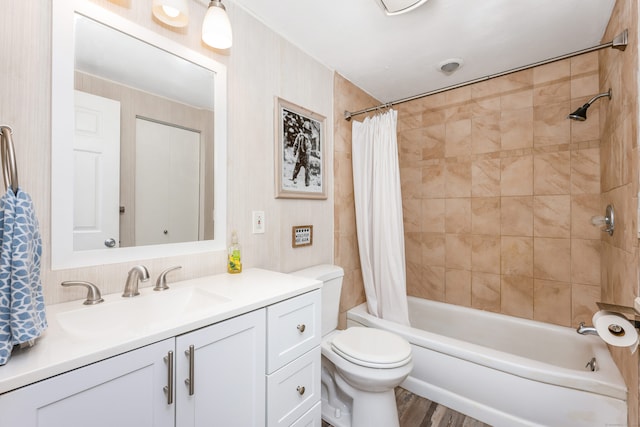 full bathroom featuring shower / bathtub combination with curtain, vanity, toilet, and wood-type flooring