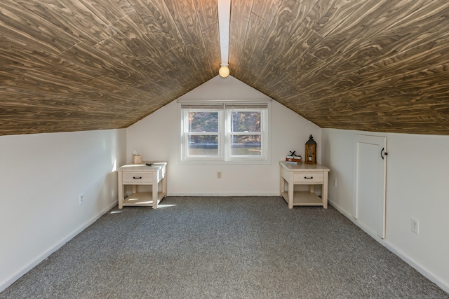 additional living space featuring wood ceiling, vaulted ceiling, and dark colored carpet