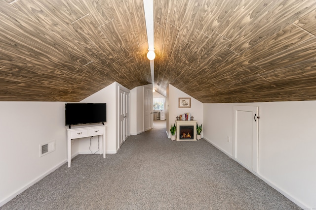 bonus room featuring lofted ceiling, a fireplace, carpet floors, and wooden ceiling