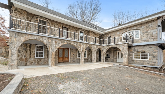 exterior space featuring a patio and a balcony