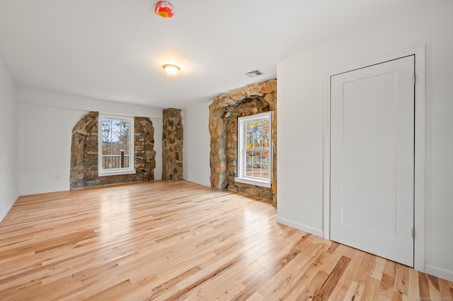 unfurnished living room featuring light hardwood / wood-style floors