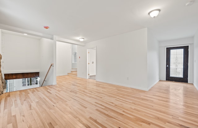 unfurnished living room with light hardwood / wood-style flooring