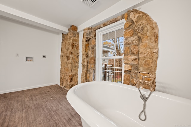 bathroom with hardwood / wood-style floors