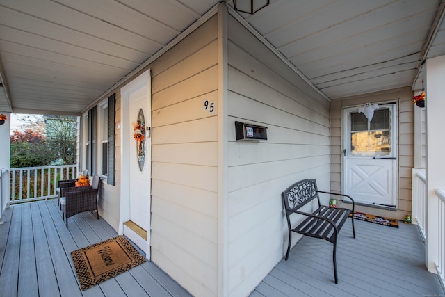 wooden deck featuring covered porch