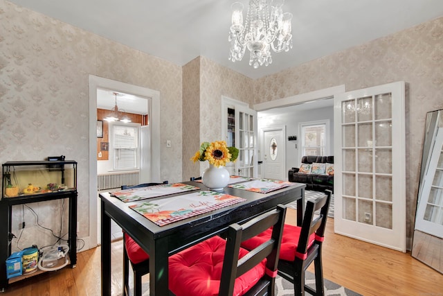 dining room featuring a chandelier and wood-type flooring