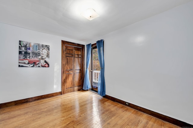 spare room with hardwood / wood-style floors