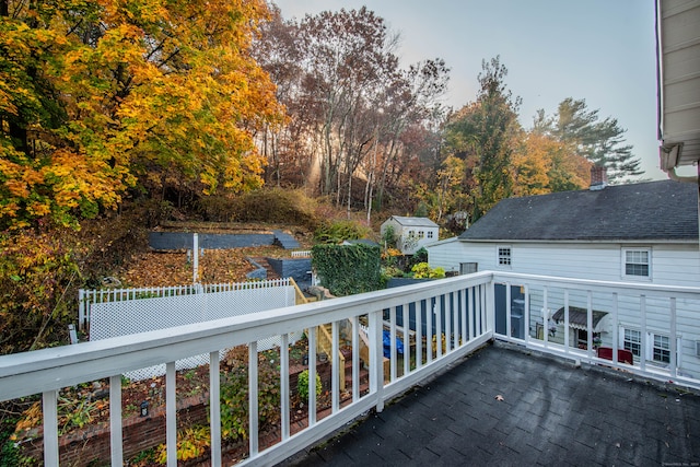 wooden terrace featuring a shed