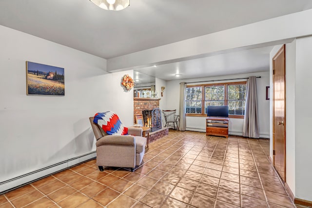 living area featuring tile patterned floors, a baseboard heating unit, and a fireplace