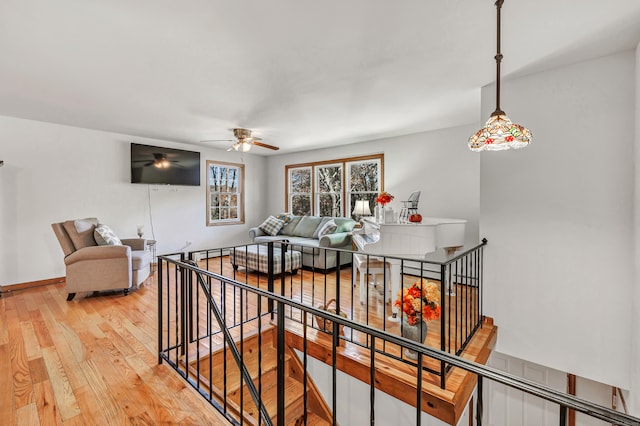 interior space with a baseboard heating unit and hardwood / wood-style floors