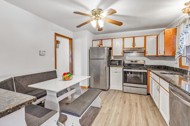 kitchen featuring white cabinetry, light hardwood / wood-style floors, stainless steel appliances, and sink