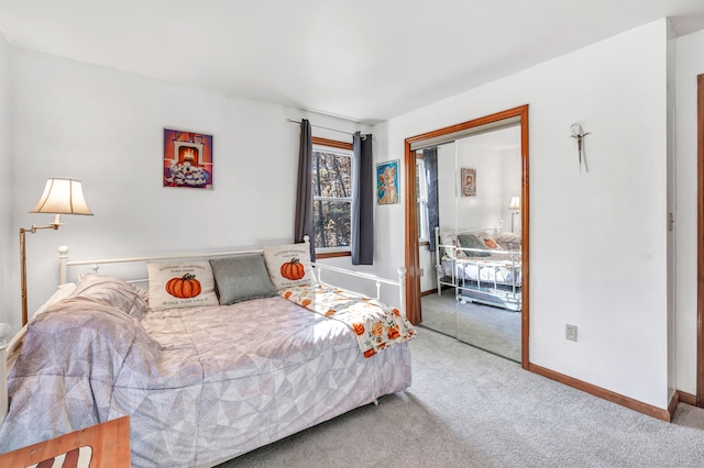 carpeted bedroom with a closet