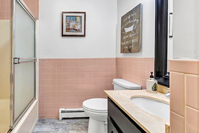 full bathroom with vanity, tile walls, toilet, and a baseboard radiator