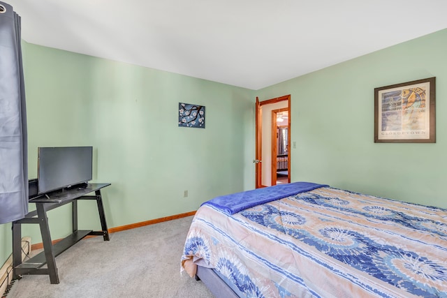 bedroom featuring light carpet