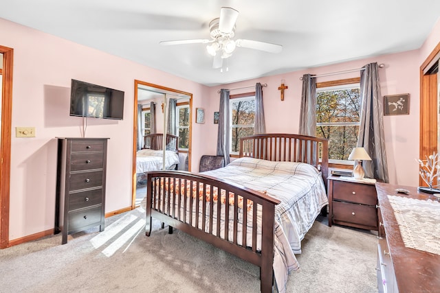 bedroom with multiple windows, a closet, and ceiling fan