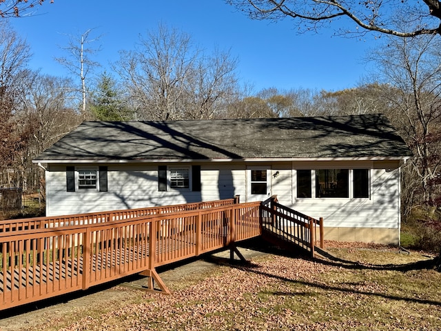 back of house with a wooden deck