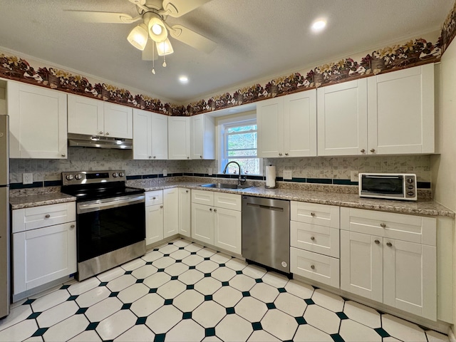 kitchen featuring white cabinets, sink, and appliances with stainless steel finishes