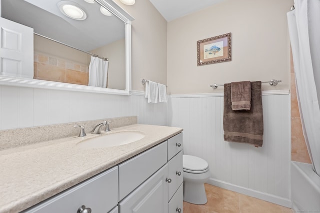 full bathroom with vanity, shower / tub combo with curtain, toilet, and tile patterned floors