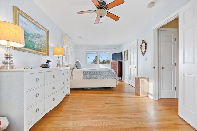 bedroom with light wood-type flooring and ceiling fan