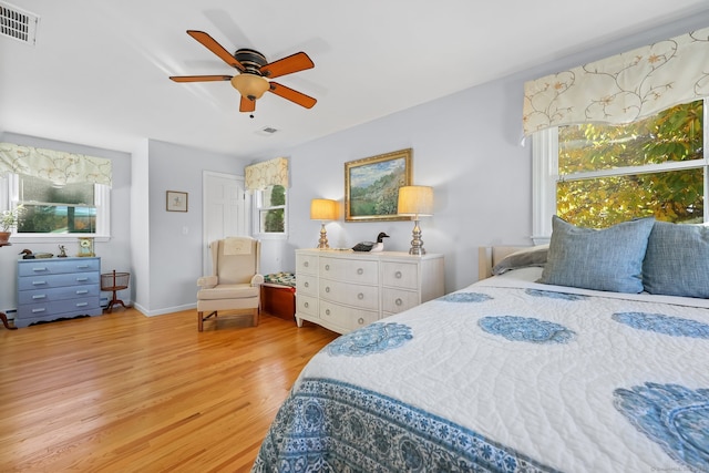 bedroom featuring light hardwood / wood-style floors and ceiling fan