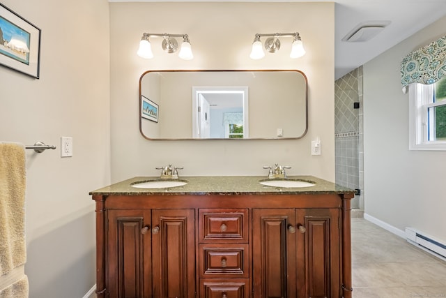 bathroom featuring vanity, a tile shower, tile patterned flooring, and a baseboard radiator