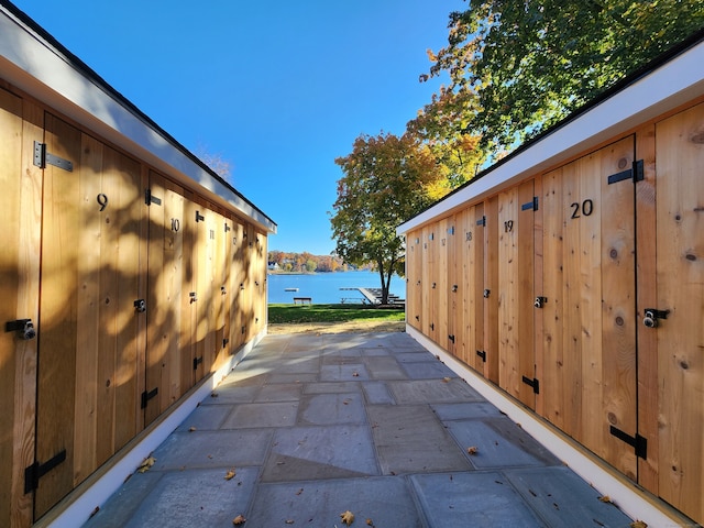 view of patio featuring a water view