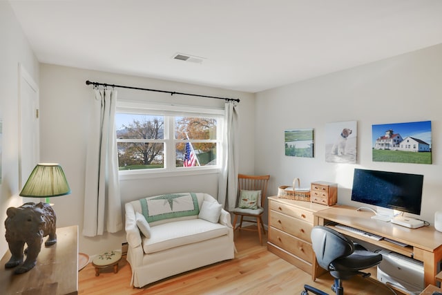 office area with light hardwood / wood-style flooring